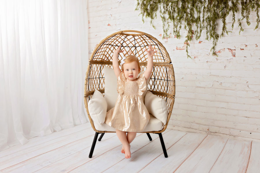 Tyrone baby photographer, girl in egg chair for simple two year milestone session