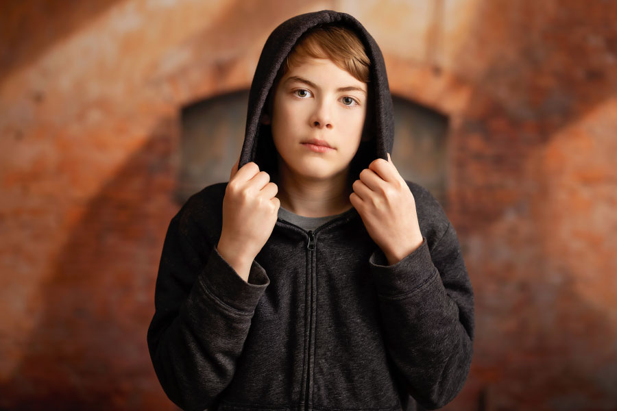 Tyrone teen photographer, boy in hoodie with urban studio set