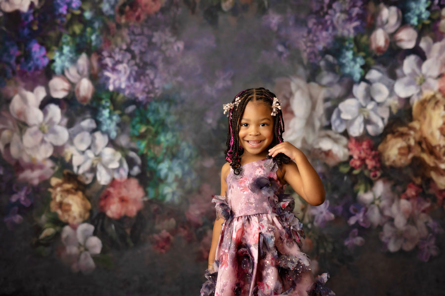 Villa Rica kids' photographer, girl with colorful floral studio backdrop