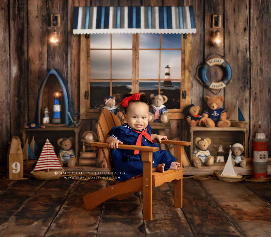 Douglasville baby photographer, girl in adirondack chair for nautical set