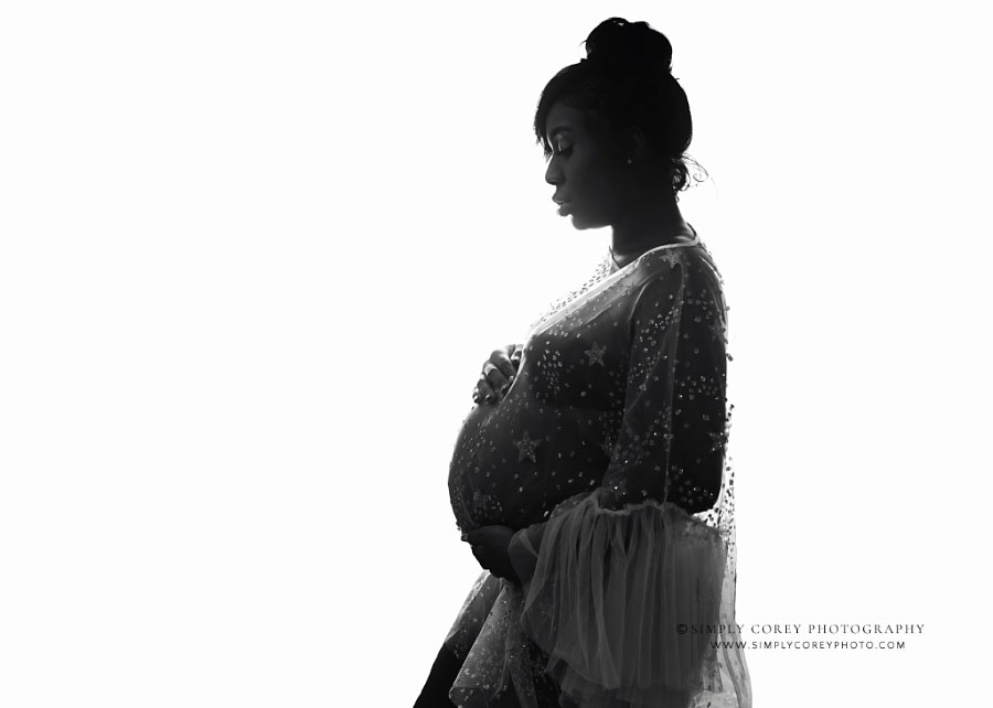 maternity photographer near Newnan, black and white silhouette with sheer dress in studio
