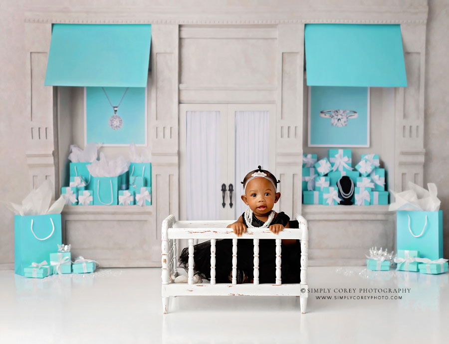 Villa Rica baby photographer, girl in crib during studio milestone session