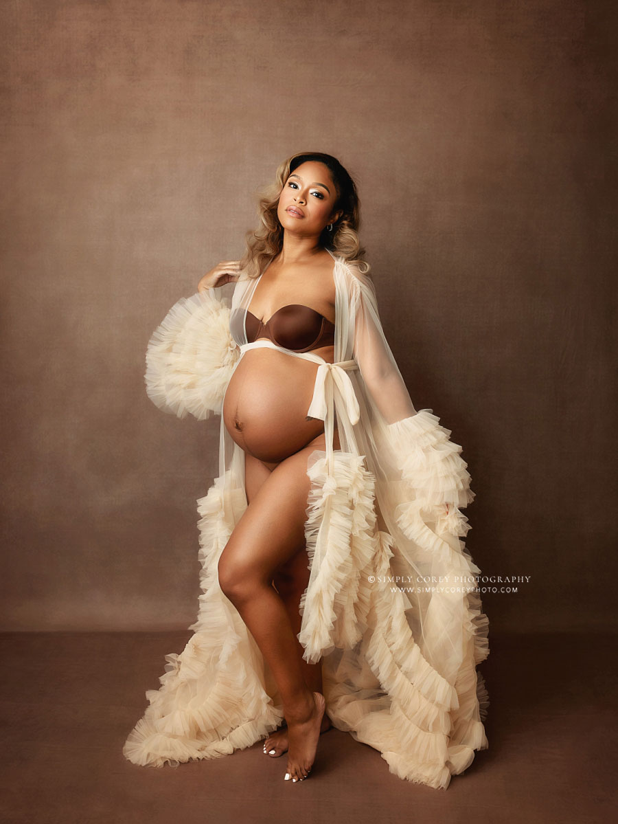 Atlanta maternity photographer, pregnancy portrait in tulle robe on brown studio set