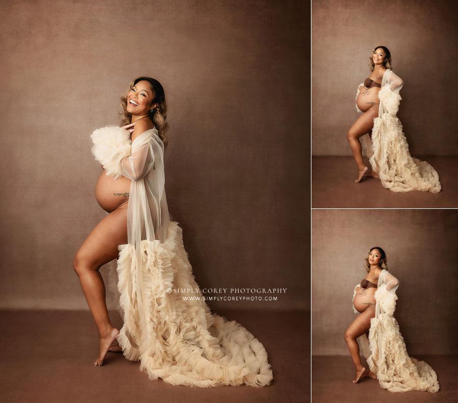 Carrollton maternity photographer in GA; mom laughing while wearing tulle robe in studio