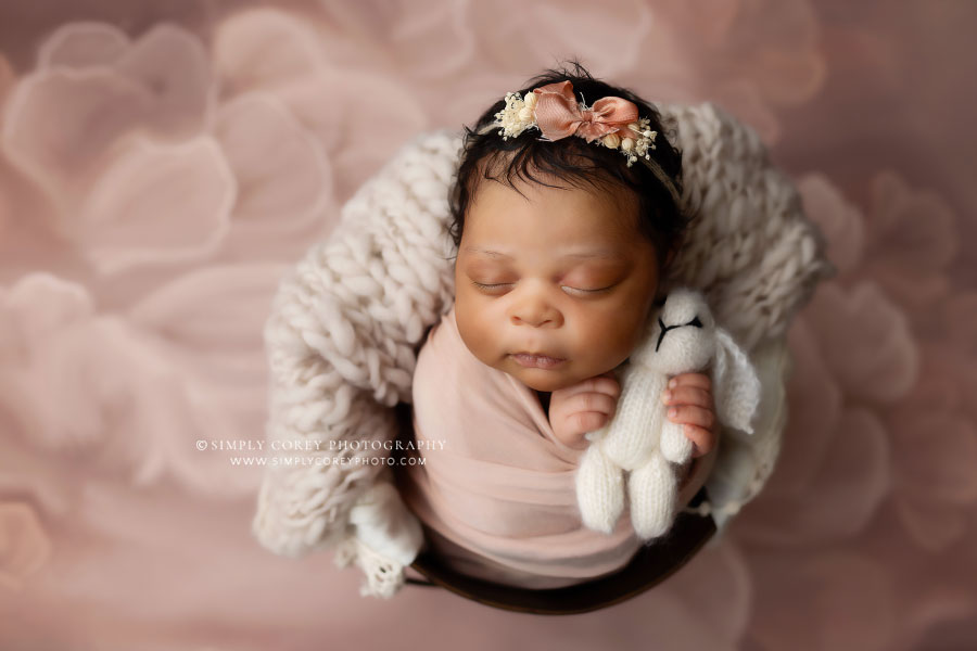 Peachtree City newborn photographer, baby girl on pink backdrop with bunny